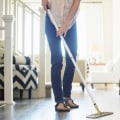 How does regular house cleaning reduce dust and allergens in my home?